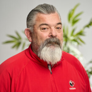 A headshot of Geoff VanMackelbergh smiling