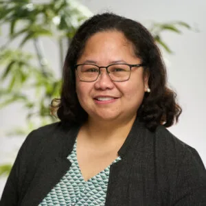 A headshot of Nerriza Bautista smiling