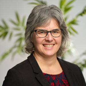 A headshot of Tracy Claeys smiling